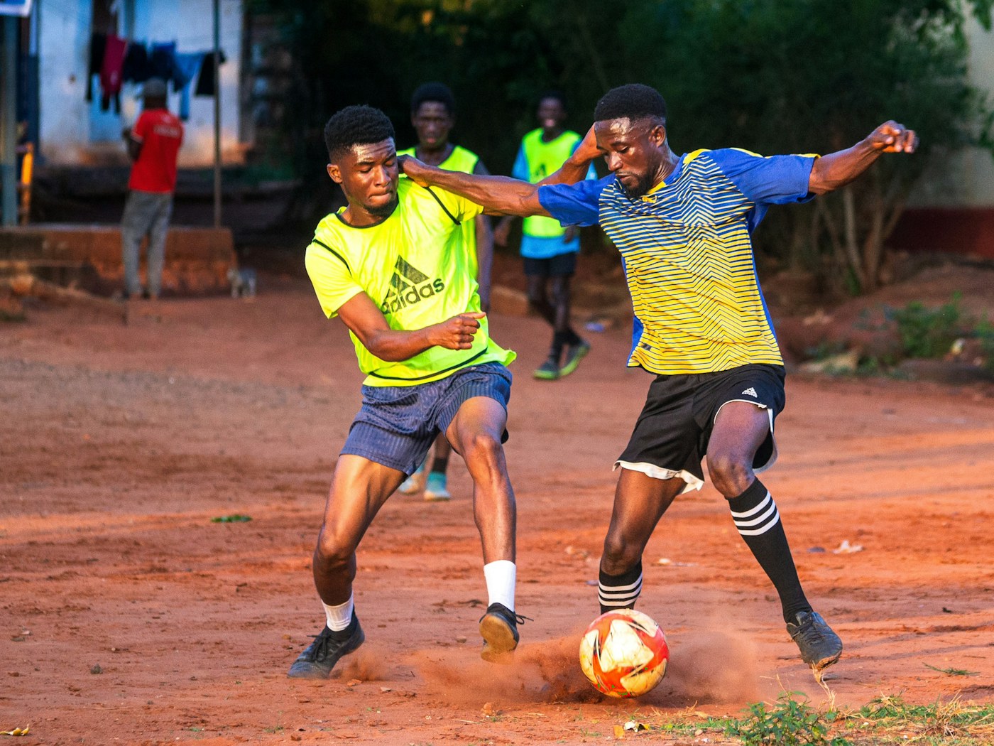 Players competing for the ball in a soccer game.